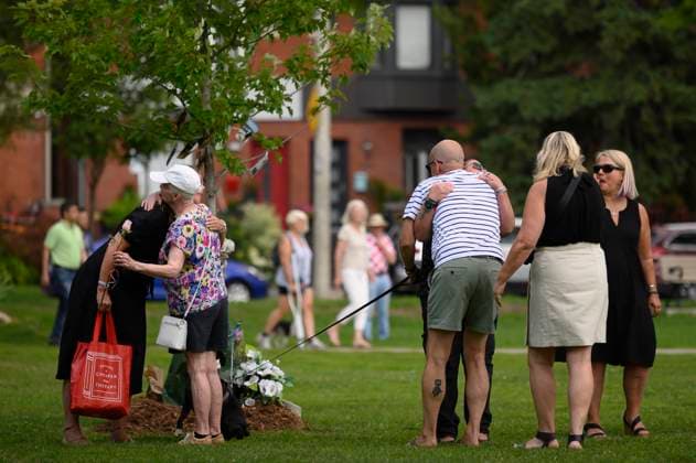 July 22, 2023, Toronto, ON, Canada: Friends and family members of Julianna Kozis and Reese Fallon, gather near trees planted in their honour, following a gathering to mark five years since the attack on the city s Danforth Avenue, at Withrow Park in Toronto, Saturday July 22, 2023. Toronto Canada  - ZUMAc35_ 20230722_zaf_c35_076 Copyright: xChristopherxKatsarovx
