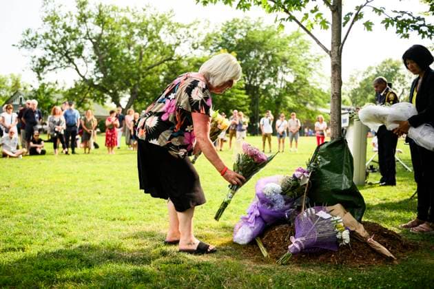 July 22, 2023, Toronto, ON, Canada: Friends and family members of Julianna Kozis and Reese Fallon, place flowers near trees planted in their honour, during a gathering to mark five years since the attack on the city s Danforth Avenue, at Withrow Park in Toronto, Saturday July 22, 2023. Toronto Canada  - ZUMAc35_ 20230722_zaf_c35_079 Copyright: xChristopherxKatsarovx