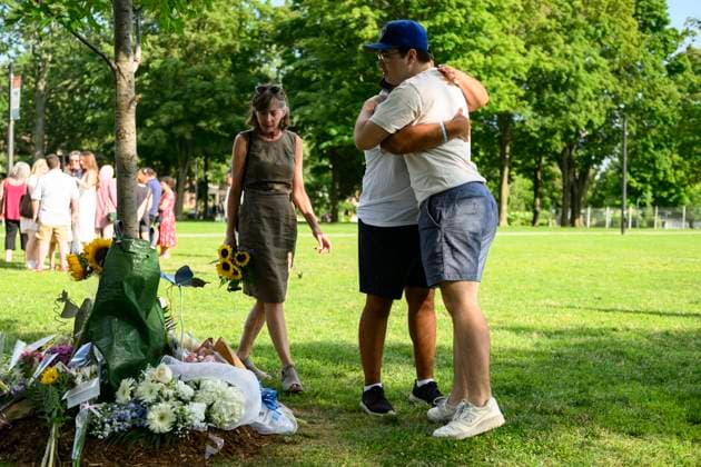 July 22, 2023, Toronto, ON, Canada: Friends and family members of Julianna Kozis and Reese Fallon, place flowers near trees planted in their honour, during a gathering to mark five years since the attack on the city s Danforth Avenue, at Withrow Park in Toronto, Saturday July 22, 2023. Toronto Canada  - ZUMAc35_ 20230722_zaf_c35_081 Copyright: xChristopherxKatsarovx