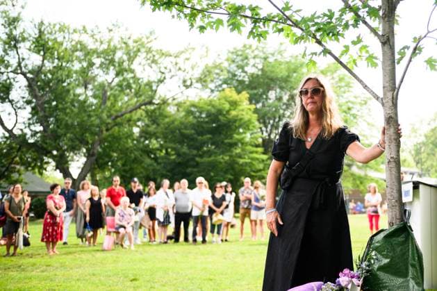July 22, 2023, Toronto, ON, Canada: Friends and family members of Julianna Kozis and Reese Fallon, place flowers near trees planted in their honour, during a gathering to mark five years since the attack on the city s Danforth Avenue, at Withrow Park in Toronto, Saturday July 22, 2023. Toronto Canada  - ZUMAc35_ 20230722_zaf_c35_085 Copyright: xChristopherxKatsarovx