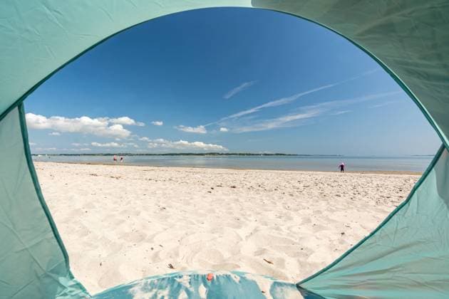 View from inside a tent onto beautiful white sand beach at the Baltic Sea at the Flensburger Förde in North Germany View from inside a tent onto beautiful white sand beach at the Baltic Sea at the Flensburger Förde in North Germany Copyright: xZoonar.com FranziskusxvonxLuckex 20486889