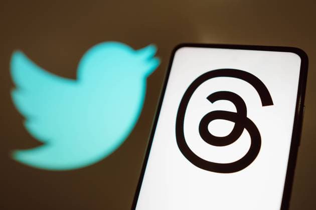 July 9, 2023, Brazil. In this photo illustration, the Threads logo is displayed on a smartphone screen with a Twitter logo in the background. July 9, 2023, Brazil. In this photo illustration, the Threads logo is displayed on a smartphone screen with a Twitter logo in the background Copyright: xZoonar.com rafapressx 20494296