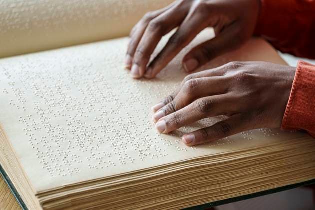 Hands of woman reading braille text from book model released, Symbolfoto property released, AAZF00768