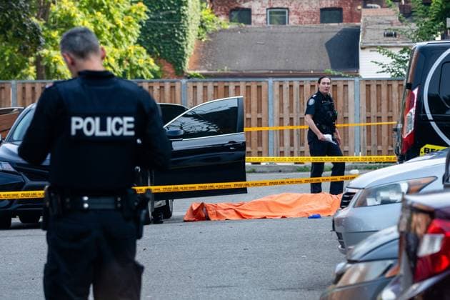 July 25, 2023, Toronto, ON, Canada: Toronto police investigate a fatal shooting in a parking lot in the city s downtown east end on Tuesday, July 25, 2023. Toronto Canada  - ZUMAc35_ 20230725_zaf_c35_009 Copyright: xColinxN.xPerkelx