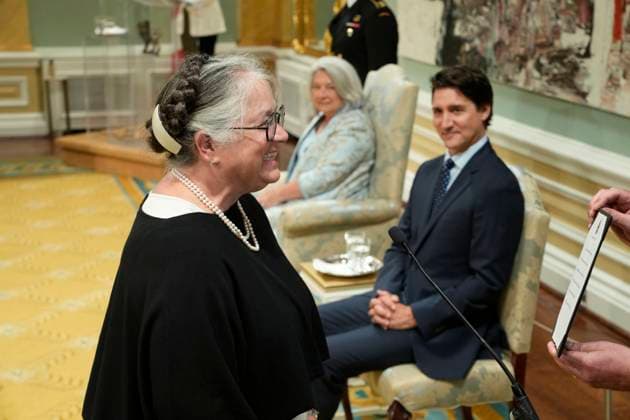 July 26, 2023, Ottawa, ON, Canada: Prime Minister Justin Trudeau looks on as Minister of Fisheries, Oceans and the Canadian Coast Guard Diane Lebouthillier takes the oath during a cabinet swearing-in ceremony at Rideau Hall in Ottawa on Wednesday, July 26, 2023. Ottawa Canada  - ZUMAc35_ 20230726_zaf_c35_122 Copyright: xAdrianxWyldx