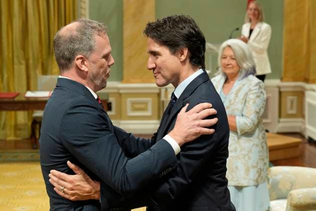 July 26, 2023, Ottawa, ON, Canada: Minister of Health Mark Holland is embraced by Prime Minister Justin Trudeau during a cabinet swearing-in ceremony at Rideau Hall in Ottawa, Wednesday, July 26, 2023. Ottawa Canada  - ZUMAc35_ 20230726_zaf_c35_148 Copyright: xAdrianxWyldx
