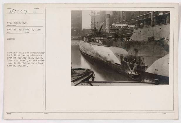 RECORD DATE NOT STATED Pvt. Kelly, s.c. took this photograph on February 26, 1919, showing the German U Boat 155 surrendering to the British. The U Boat is seen parked alongside the British Mystery Ship, H.M.S. Suffolk Coast , moored at St. Katherine s Dock in London, England. This image was issued with the following notes: 41007. Copyright: xpiemagsx 985_55241137 !ACHTUNG AUFNAHMEDATUM GESCHÄTZT!