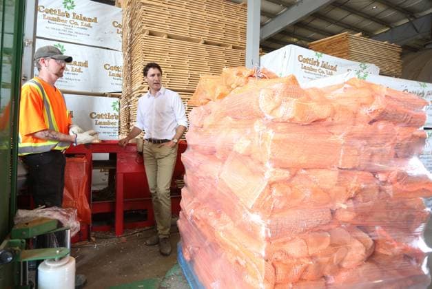 July 27, 2023, Summerford, NL, CANADA: Adam Quip, left, shows Prime Minister Justin Trudeau packaged firewood at Cottles Island Lumber in Summerford, Newfoundland and Labrador on Thursday, July 27, 2023. Summerford CANADA  - ZUMAc35_ 20230727_zaf_c35_010 Copyright: xPaulxDalyx