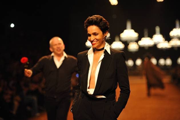 Paris fashion week - Hermes Catwalk French fashion designer Jean Paul Gaultier flanked by famous model Farida Khelfa walks the runway during his presentation for Hermes spring-summer 2011 ready-to wear collection presentation held at Halle Freyssinet in Paris, France on October 6, 2010. Photo by Thierry Orban ABACAPRESS.COM Paris France  Copyright: xOrbanxThierry ABACAx 246991_010 OrbanxThierry ABACAx 246991_010 