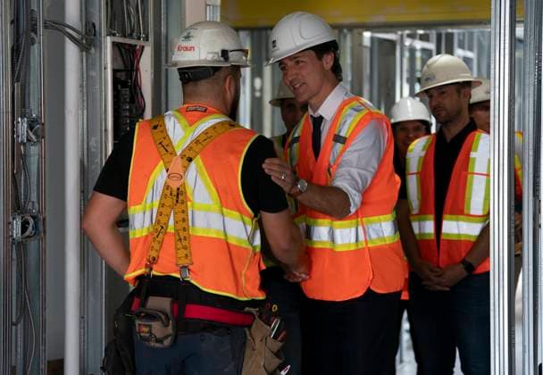 July 31, 2023, Hamilton, Ont, CAN: Prime Minister Justin Trudeau speaks with electrician Kyle Pula during a visit to an apartment complex under construction in Hamilton, Ont., Monday, July 31, 2023. He was joined today by the Mayor of Hamilton, Andrea Horwath, to announce a joint investment of nearly $64 million from the Government of Canada and the City of Hamilton to build and repair 214 homes for families in the city. Hamilton CAN - ZUMAc35_ 20230731_zaf_c35_068 Copyright: xPeterxPowerx