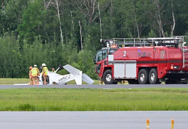 August 1, 2023, QUEBEC CITY, PQ, Canada: Firefighters look over a Cessna 152 aircraft after it crashed on landing at the Jean-Lesage Airport on Tuesday, Aug. 1, 2023 in Quebec City. One person was reported injured. QUEBEC CITY Canada  - ZUMAc35_ 20230801_zaf_c35_021 Copyright: xJacquesxBoissinotx