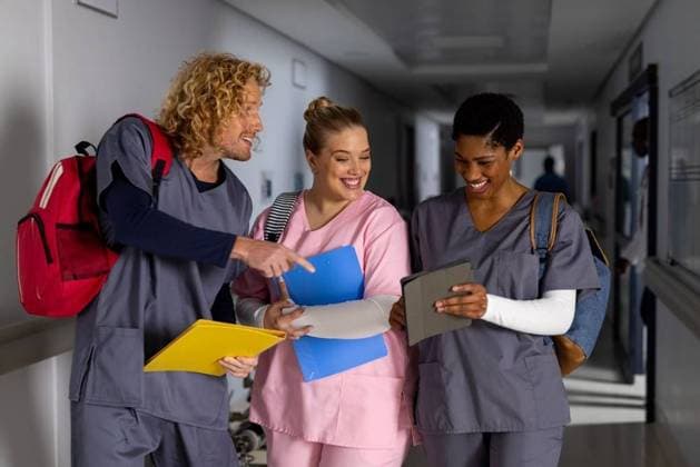 Happy diverse doctors wearing scrubs discussing work and using tablet in corridor at hospital Happy diverse doctors wearing scrubs discussing work and using tablet in corridor at hospital. Hospital, communication, teamwork, medicine, healthcare and work, unaltered., model released, , property released, Cape Town, South Africa, 2023-05-19T22:00:00.000Z, 4139224.jpg, people,happy,diverse,doctor,wearing,scrub,discussing,work,using tablet,corridor,hospital,communication,teamwork,medicine,healthcare,unaltered,medical,clinic,care,patient,health,treatment,professional,illness,nurse,disease,stethoscope,team,specialist,person,laboratory,young,occupation,office,physician,technology,using,tablet Young Adult,Woman,Female,White,Mid Adult,Man,Male,Black