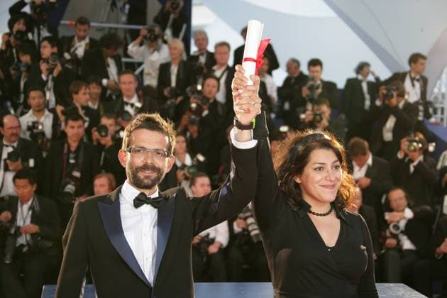 60th Cannes Film Festival - Palme d Or prize photocall Co-directors Marjane Satrapi and Vincent Paronnaud pose with the Grand Jury prize for the animated film Persepolis at the Festival Palace in Cannes, southern France. A harrowing Romanian film won Cannes top prize late 27 May as the world s biggest film festival brought the curtain down on a 12-day run remarkable for its star-studded brightness -- and the death-obsessed darkness of its movies. 4 Months, 3 Weeks and 2 Days elbowed aside 21 other films to snatch the golden trophy at a glittering ceremony marking the end of the festival s 60th edition. Photo by Hahn-Nebinger-Orban ABACAPRESS.COM Cannes France  Copyright: xHahn-Nebinger-Orban ABACAx 123447_193 Hahn-Nebinger-Orban ABACAx 123447_193 