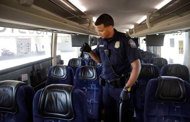July 31, 2023, Laredo, TX, United States: A U.S. Customs and Border Protection officer inspects a bus for contraband at the border crossing from Mexico, July 31, 2023 in Laredo, Texas. Laredo United States - ZUMAp138 20230731_zaa_p138_011 Copyright: xGlennxFawcett CbpxPhotosx