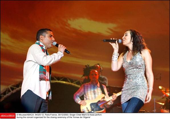 54325 12 Mousse ABACA. 54325-12. Paris-France, 30 12 2003. Singer Cheb Mami & Assia perfom during the concert organized for the closing ceremony of the Annee de l Algerie  Copyright: xMousse ABACAx 54325_12 Mousse ABACAx 54325_12
