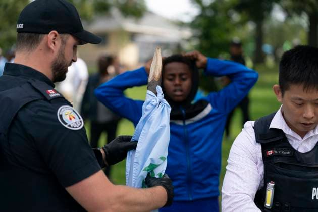 August 5, 2023, Toronto, ON, Canada: A Toronto Police officer holds a shaped stick collected as evidence at the scene of a protest that turned violent in Earlscourt Park in Toronto, on Saturday, August 5 2023. Toronto police say one person was stabbed and eight others were injured during a protest in the cityöÄÃ s west end. Toronto Canada  - ZUMAc35_ 20230805_zaf_c35_005 Copyright: xArlynxMcadoreyx