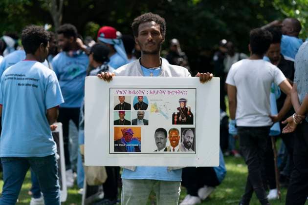 August 5, 2023, Toronto, ON, Canada: A protestor holds a sign in Earlscourt Park in Toronto, on Saturday, August 5 2023. Toronto police say one person was stabbed and eight others were injured during a protest in the cityöÄÃ s west end. Toronto Canada  - ZUMAc35_ 20230805_zaf_c35_044 Copyright: xArlynxMcadoreyx