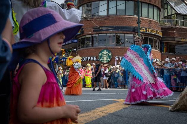 August 6, 2023, VANCOUVER, BC, CANADA: A young girl watches as drag performers pass during the Pride Parade at English Bay in Vancouver, B.C., Sunday, Aug. 6, 2023. VANCOUVER CANADA  - ZUMAc35_ 20230806_zaf_c35_008 Copyright: xEthanxCairnsx