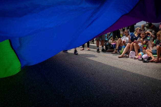 August 6, 2023, VANCOUVER, BC, CANADA: People watch as the Pride Parade passes at English Bay in Vancouver, B.C., Sunday, Aug. 6, 2023. VANCOUVER CANADA  - ZUMAc35_ 20230806_zaf_c35_016 Copyright: xEthanxCairnsx