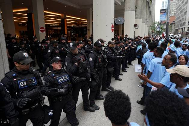 August 6, 2023, Toronto, ON, Canada: Toronto Police work the scene of a protest outside of the Sheraton Hotel in downtown Toronto, on Sunday, August 6 2023. The city of Toronto revoked the permit for an Eritrean cultural festival scheduled to run through the August long weekend after a number of violent clashes between participants and protesters sent nine people to hospital and stalled local traffic for hours. Toronto Canada  - ZUMAc35_ 20230806_zaf_c35_047 Copyright: xArlynxMcadoreyx