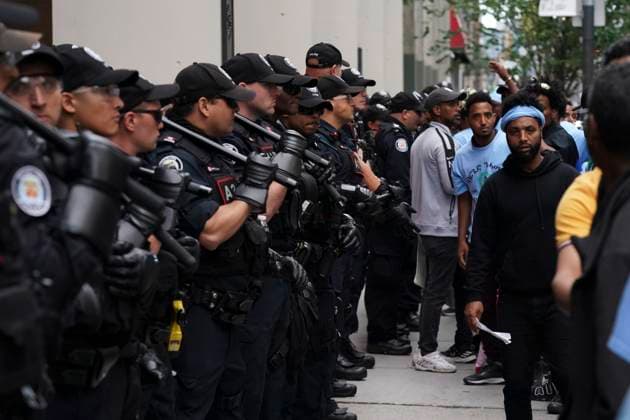 August 6, 2023, Toronto, ON, Canada: Toronto Police work the scene of a protest outside of the Sheraton Hotel in downtown Toronto, on Sunday, August 6 2023. The city of Toronto revoked the permit for an Eritrean cultural festival scheduled to run through the August long weekend after a number of violent clashes between participants and protesters sent nine people to hospital and stalled local traffic for hours. Toronto Canada  - ZUMAc35_ 20230806_zaf_c35_051 Copyright: xArlynxMcadoreyx