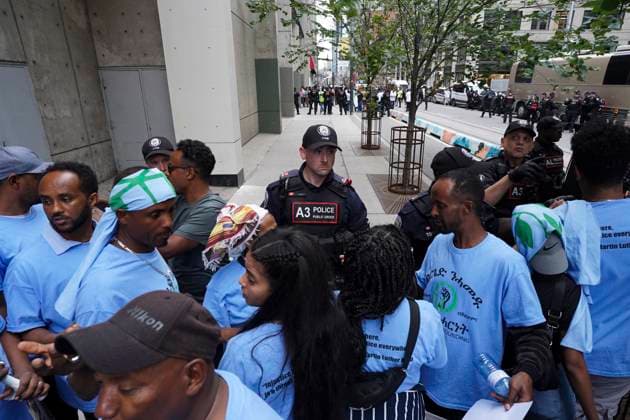 August 6, 2023, Toronto, ON, Canada: Toronto Police work the scene of a protest outside of the Sheraton Hotel in downtown Toronto on Sunday, August 6, 2023. The city of Toronto revoked the permit for an Eritrean cultural festival scheduled to run through the August long weekend after a number of violent clashes between participants and protesters sent nine people to hospital and stalled local traffic for hours. Toronto Canada  - ZUMAc35_ 20230806_zaf_c35_055 Copyright: xArlynxMcadoreyx