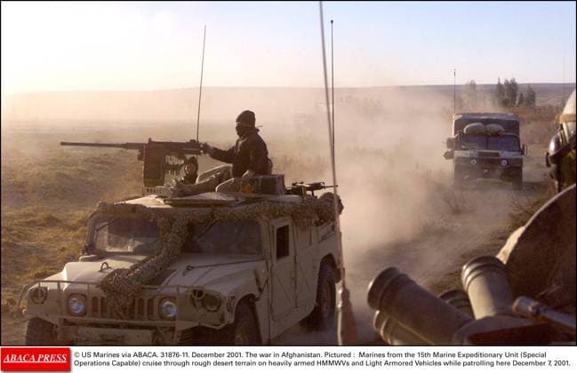 31876 11 US Marines via ABACA. 31876-11. December 2001. The war in Afghanistan. Pictured : Marines from the 15th Marine Expeditionary Unit (Special Operations Capable) cruise through rough desert terrain on heavily armed HMMWVs and Light Armored Vehicles while patrolling here December 7, 2001.  Copyright: xABACAx 31876_11 ABACAx 31876_11
