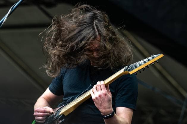 George Kosmas, singer and guitarist of Australian music band Be lakor, performs during the first day of the Brutal Assault music festival focused on metal, on August 9, 2023, at the Josefov Fortress in Jaromer, Czech Republic. (CTKxPhoto DavidxTanecek) CTKPhotoP2023080906195  CTKPhotoP2023080906195