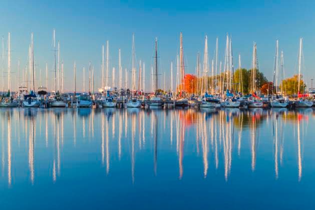 USA, Wisconsin. Panoramic view of Fall colors reflected on the still waters of the harbor in Bayfield on Lake Superior.  Copyright: xAerialxMediaxTech,xLLCx(RBE)x x US50 RBE0002