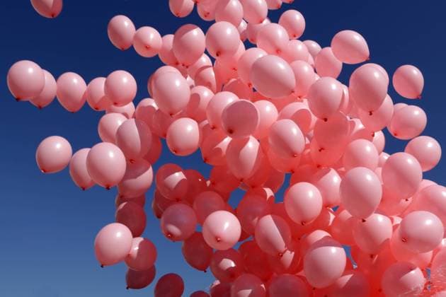 Hundreds of pink balloons Hundreds of pink balloons are released against the blue sky in memory of women passed away because of breast cancer last year. Copyright: xZoonar.com Cylonphotox 14550745