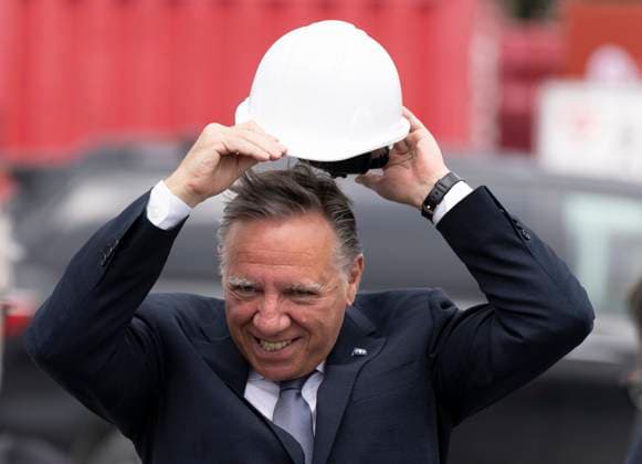 August 17, 2023, BECANCOUR, PQ, Canada: Quebec Premier Francois Legault puts on a hard hat as he arrives to break ground on the construction site of the new Ford manufacturing plant in Becancour, Que., Thursday, Aug.17, 2023. BECANCOUR Canada  - ZUMAc35_ 20230817_zaf_c35_028 Copyright: xChristinnexMuschix