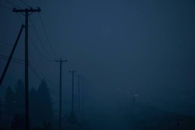 August 20, 2023, KAMLOOPS, BC, CANADA: Thick smoke from wildfires burning in the area hangs in the air as motorists travel on the Trans-Canada Highway east of Kamloops, B.C., on Sunday, August 20, 2023. KAMLOOPS CANADA  - ZUMAc35_ 20230820_zaf_c35_160 Copyright: xDarrylxDyckx