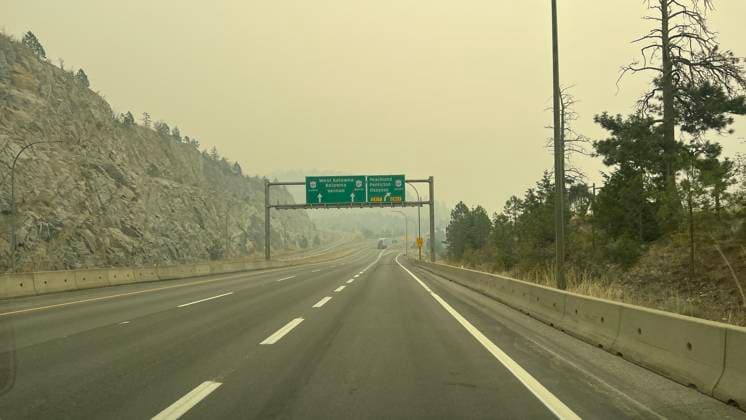 (230821) -- KELOWNA, Aug. 21, 2023 -- Smoke from wildfires hangs over the highway to Kelowna, British Columbia, Canada, on Aug. 20, 2023. Canada s British Columbia government said Saturday it will implement a restriction on non-essential travel to areas affected by wildfires amid its state of emergency. The government has declared a provincial state of emergency as thousands evacuated from their homes. (Photo by Wan Bin Xinhua) CANADA-BRITISH COLUMBIA-KELOWNA-WILDFIRE-SMOKE LinxWei 