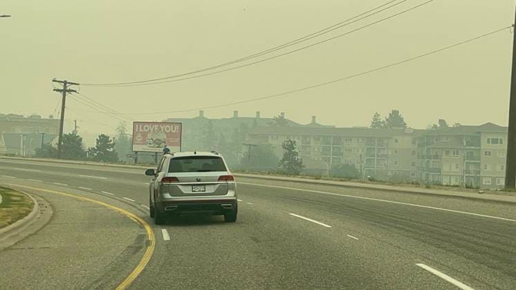 (230821) -- KELOWNA, Aug. 21, 2023 -- Smoke from wildfires hangs over the highway to West Kelowna, British Columbia, Canada, on Aug. 20, 2023. Canada s British Columbia government said Saturday it will implement a restriction on non-essential travel to areas affected by wildfires amid its state of emergency. The government has declared a provincial state of emergency as thousands evacuated from their homes. (Photo by Wan Bin Xinhua) CANADA-BRITISH COLUMBIA-KELOWNA-WILDFIRE-SMOKE LinxWei 