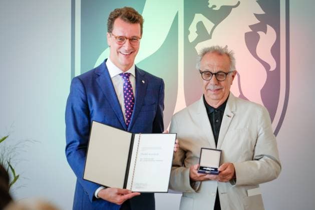 Award of the Order of Merit of the State of North Rhine Westphalia Dieter Kosslick from Berlin first managing director of the Filmstiftung NRW has the development of North Rhine Westphalia with Hendrik Wuest State Premier of North Rhine Westphalia with the Cross of Merit and the certificate a