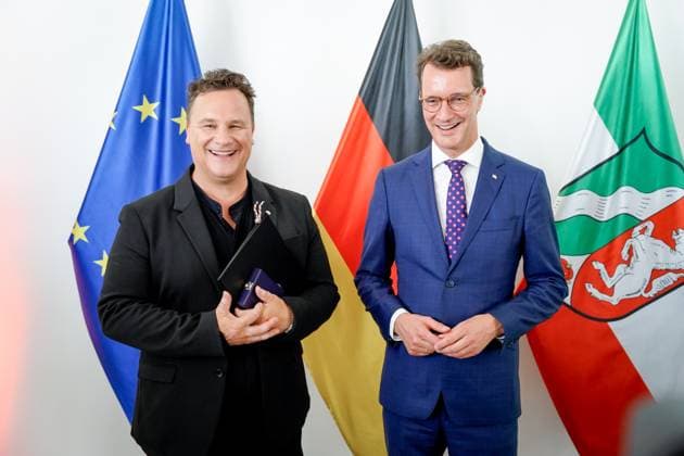 Award of the Order of Merit of the State of North Rhine Westphalia Guido Maria Kretschmer from Hamburg the fashion designer and popular presenter with Hendrik Wuest Prime Minister of North Rhine Westphalia with the Cross of Merit and the certificate following the award of the Order of Merit of the State of North Rhine