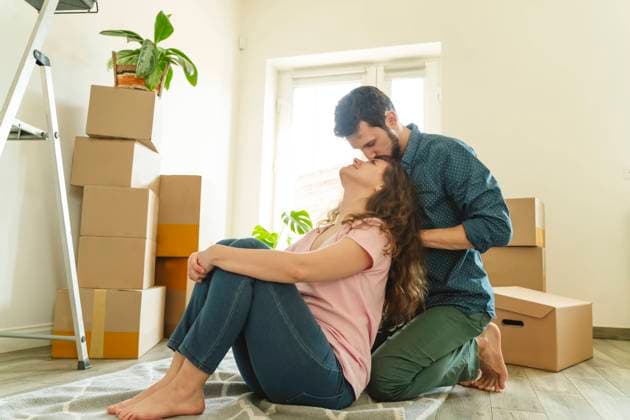 Romantic man kneeling and kissing girlfriend at new home model released, Symbolfoto property released, OSF01943