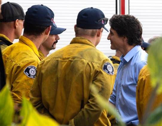 August 25, 2023, West Kelowna, BC, Canada: Prime Minister Justin Trudeau, right, speaks with West Kelowna firefighters at a fire hall in West Kelowna, B.C. on Friday, Aug. 25, 2023. West Kelowna Canada  - ZUMAc35_ 20230825_zaf_c35_108 Copyright: xMarissaxTielx
