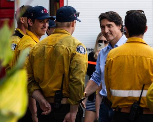 August 25, 2023, West Kelowna, BC, Canada: Prime Minister Justin Trudeau, second right, speaks with West Kelowna firefighters at a fire hall in West Kelowna, B.C. on Friday, Aug. 25, 2023. West Kelowna Canada  - ZUMAc35_ 20230825_zaf_c35_109 Copyright: xMarissaxTielx