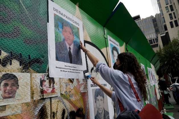 August 25, 2023, Mexico City, Mexico: Activists post photographs of victims of forced disappearance in the so-called Dirty War period in 1974 in the state of Guerrero. The protest at the Glorieta at y the Disappeared on Reforma avenue in Mexico City. on August 25, 2023 in Mexico City, Mexico Mexico City Mexico - ZUMAe321 20230825_zia_e321_010 Copyright: xLuisxBarronx