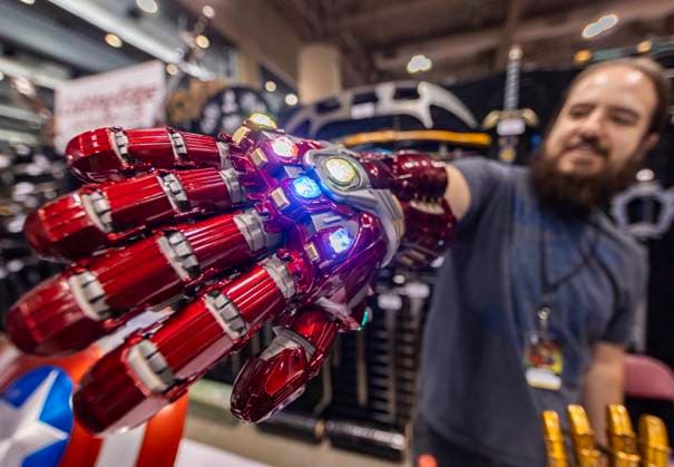 (230825) -- TORONTO, Aug. 25, 2023 -- An exhibitor shows an iron man infinity gauntlet during the 2023 Fan Expo Canada in Toronto, Canada, on Aug. 25, 2023. As one of the largest comics, sci-fi, anime and gaming events in Canada, the annual event is held here from Aug. 24 to Aug. 27, attracting hundreds of thousands of fans from across the world. (Photo by Xinhua) CANADA-TORONTO-FAN EXPO CANADA ZouxZheng 