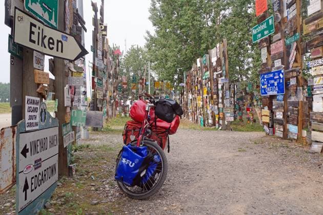 Miscellaneous Traffic and Ortschilder Standing a with Luggage loaded Bicycle, Sign Forest, Adventure trip, Watson Brine, Yukon Territory, Canada, North America Copyright: imageBROKER/ReinhardxPantke iblrpa09447488.jpg