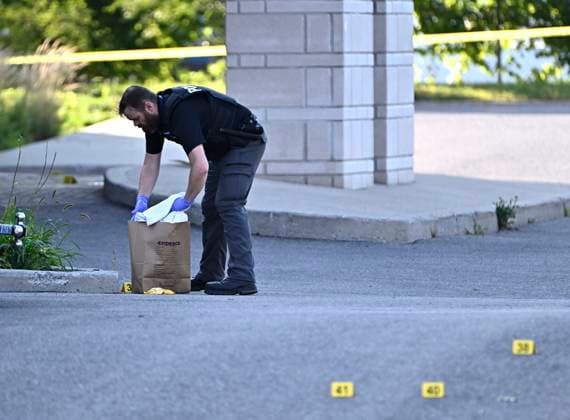 September 3, 2023, Ottawa, ON, CAN: An Ottawa Police officer collects evidence after a Saturday night shooting at the Infinity Convention Centre that left two dead, in Ottawa, on Sunday, Sept. 3, 2023. Ottawa CAN  - ZUMAc35_ 20230903_zaf_c35_005 Copyright: xJustinxTangx