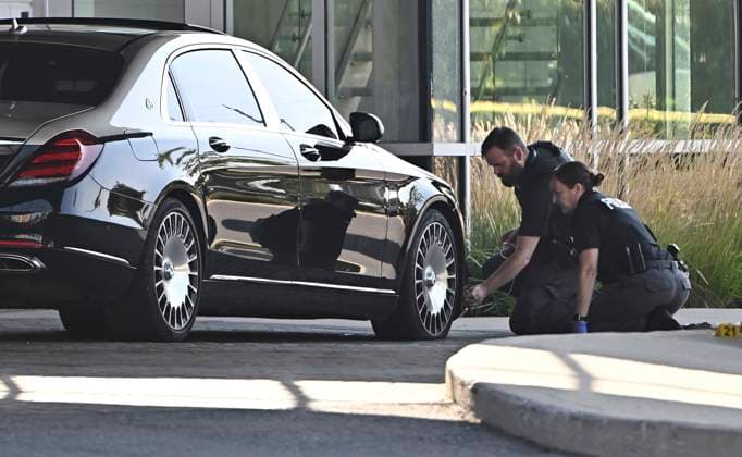 September 3, 2023, Ottawa, ON, CAN: Ottawa Police officers examine the front end of a Mercedes Maybach sedan as they collect evidence after a Saturday night shooting at the Infinity Convention Centre that left two dead, in Ottawa, on Sunday, Sept. 3, 2023. Ottawa CAN  - ZUMAc35_ 20230903_zaf_c35_009 Copyright: xJustinxTangx
