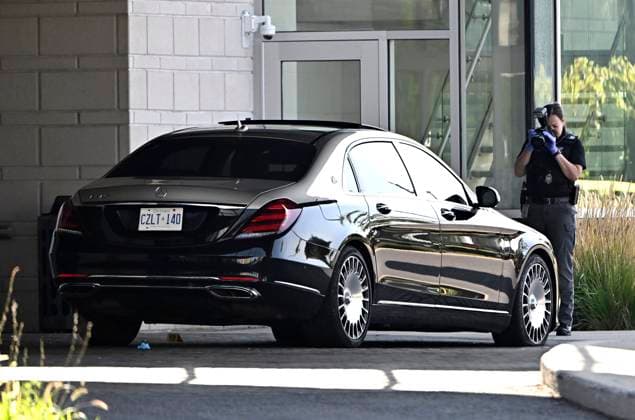 September 3, 2023, Ottawa, ON, CAN: An Ottawa Police officer photographs a Mercedes Maybach sedan as they collect evidence after a Saturday night shooting at the Infinity Convention Centre that left two dead, in Ottawa, on Sunday, Sept. 3, 2023. Ottawa CAN  - ZUMAc35_ 20230903_zaf_c35_010 Copyright: xJustinxTangx