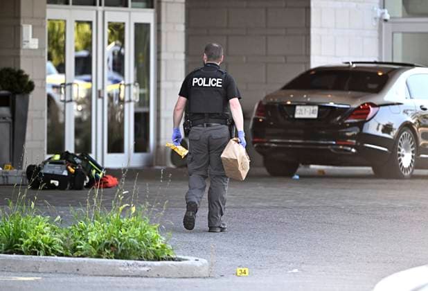September 3, 2023, Ottawa, ON, CAN: An Ottawa Police officer collects evidence after a Saturday night shooting at the Infinity Convention Centre that left two dead, in Ottawa, on Sunday, Sept. 3, 2023. Ottawa CAN  - ZUMAc35_ 20230903_zaf_c35_001 Copyright: xJustinxTangx