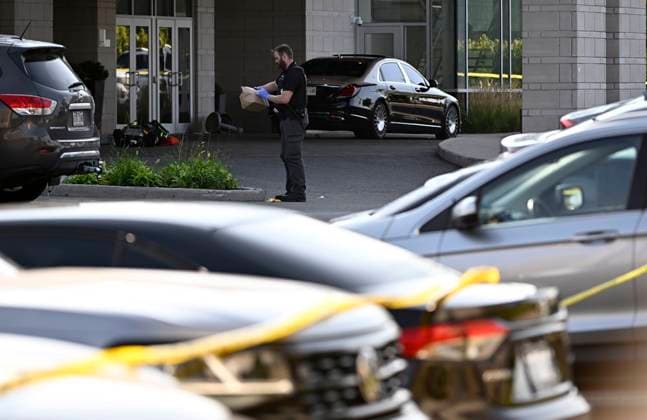 September 3, 2023, Ottawa, ON, CAN: An Ottawa Police officer collects evidence after a Saturday night shooting at the Infinity Convention Centre that left two dead, in Ottawa, on Sunday, Sept. 3, 2023. Ottawa CAN  - ZUMAc35_ 20230903_zaf_c35_004 Copyright: xJustinxTangx