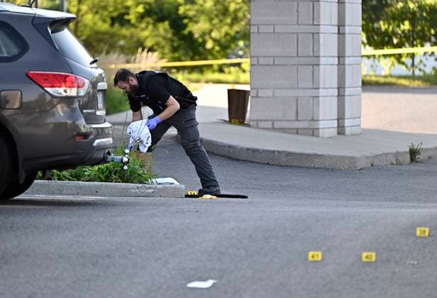 September 3, 2023, Ottawa, ON, CAN: An Ottawa Police officer collects evidence after a Saturday night shooting at the Infinity Convention Centre that left two dead, in Ottawa, on Sunday, Sept. 3, 2023. Ottawa CAN  - ZUMAc35_ 20230903_zaf_c35_006 Copyright: xJustinxTangx