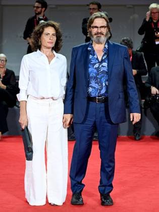 Venice, 80th Venice Film Festival 2023 - Evening 5 - red carpet Filming Italy. In the photo Giuseppe Battiston with his wife  Copyright: xManuelexMangiarottix xipa-agencyx xPoolxPhotoxEventsx02x IPA_IPA40045332