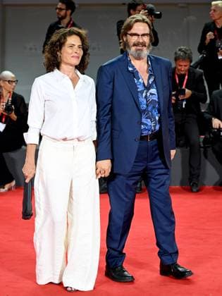 Venice, 80th Venice Film Festival 2023 - Evening 5 - red carpet Filming Italy. In the photo Giuseppe Battiston with his wife  Copyright: xManuelexMangiarottix xipa-agencyx xPoolxPhotoxEventsx02x IPA_IPA40045343